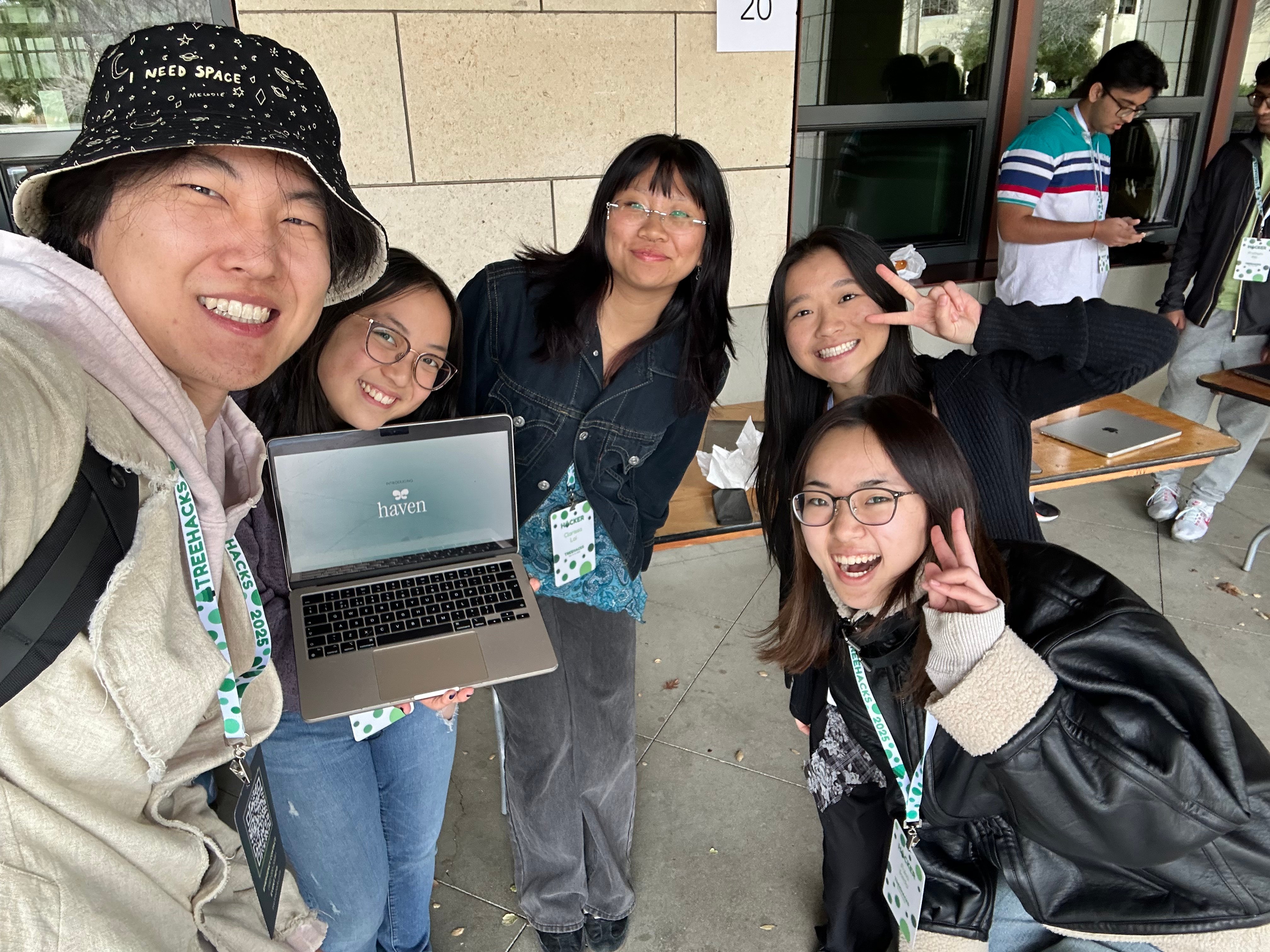 A group of people sitting on the ground/p>p>Description automatically generated